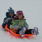 Children enjoying the winter weather Children and play time in the snow